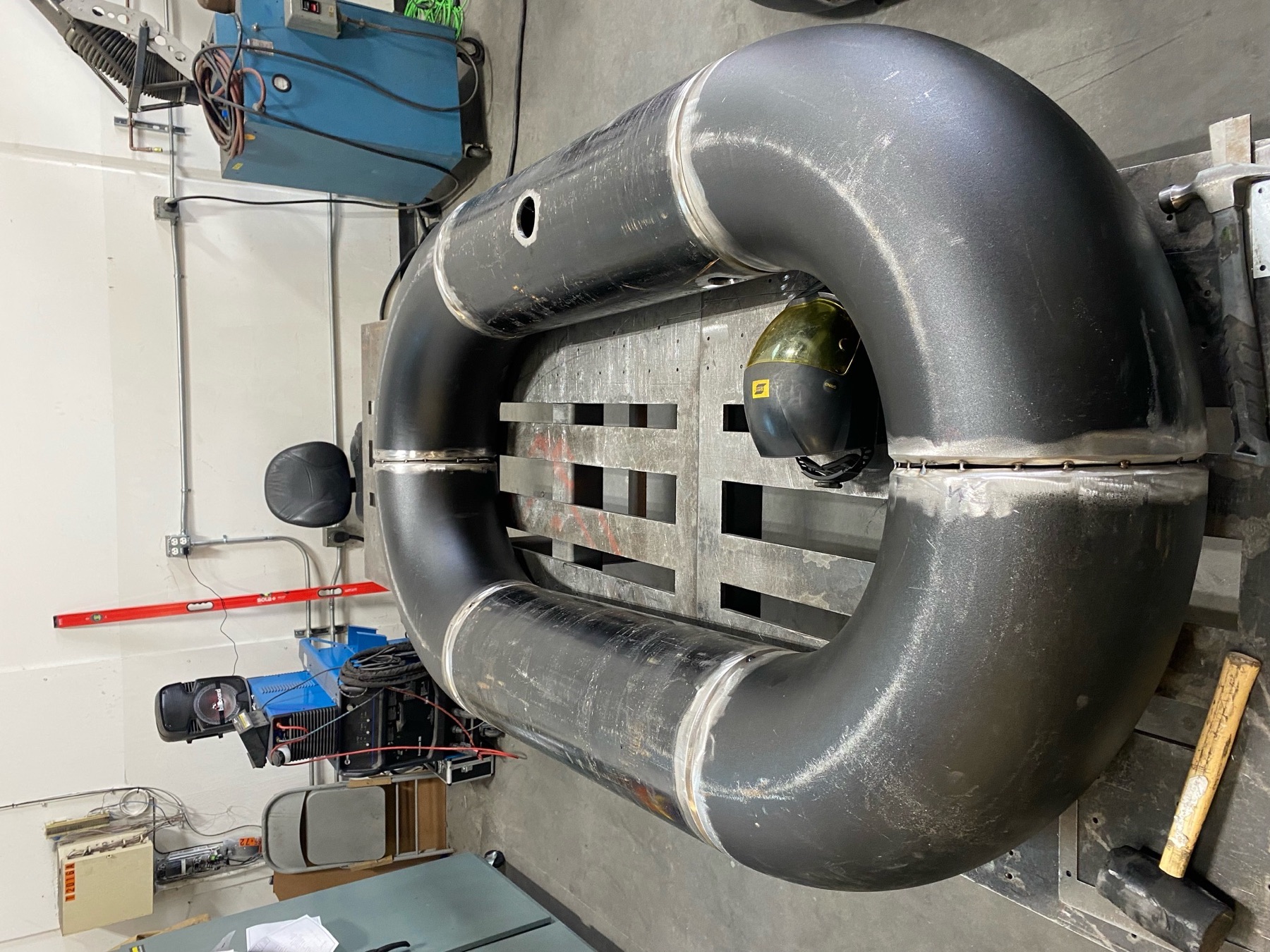 Substantial curved industrial pipe assembly fabricated by Jones